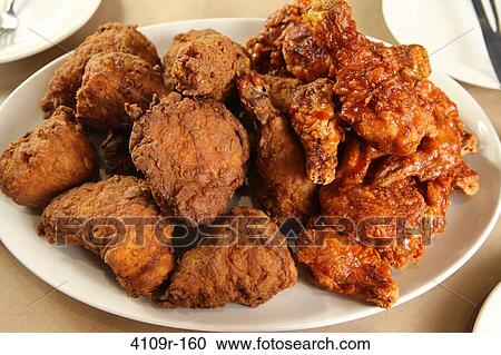 Close-up of fried chicken served in a plate View Large Photo Image Stock Image - Close-up of fried chicken served in a plate. Fotosearch