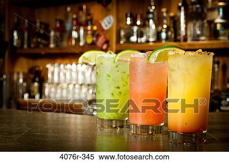 Close up of frosty cocktails on bar counter View Large Photo Image Stock Photography - Close up of frosty cocktails on bar counter. Fotosearch