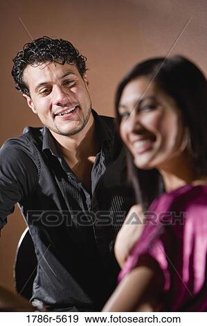Close-up of happy multiracial couple View Large Photo Image Stock Photo - Close-up of happy multiracial couple. Fotosearch