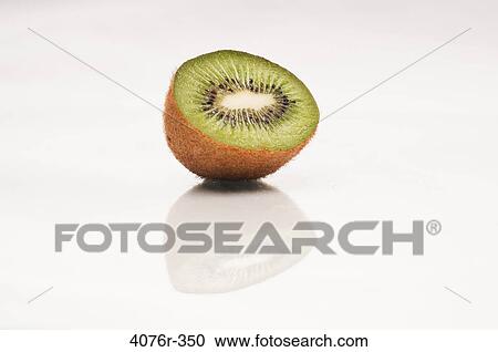 Close up of kiwi half on white background View Large Photo Image Stock Image - Close up of kiwi half on white background. Fotosearch