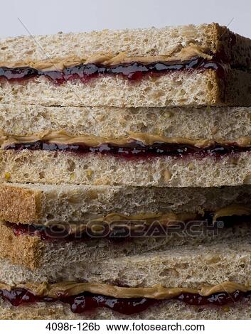 Stock Image - Close-up of peanut butter and jelly sandwiches. Fotosearch