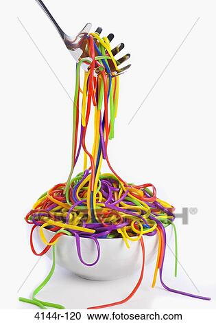 Stock Image - Close-up of rainbow colored pasta. Fotosearch