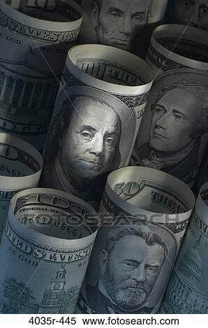 Stock Photography - Close-up of rolled up US paper currency. Fotosearch