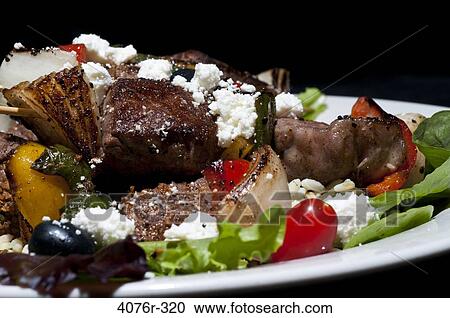 Stock Image - Close up of steak salad. Fotosearch