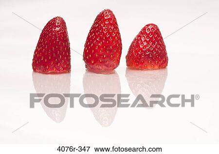 Close up of strawberries on white background View Large Photo Image Stock Photo - Close up of strawberries on white background. Fotosearch