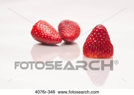 Close up of strawberries on white background View Large Photo Image Stock Photograph - Close up of strawberries on white background. Fotosearch