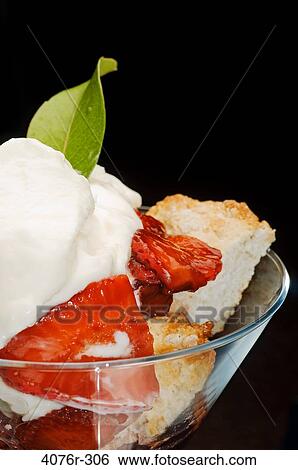 Stock Photograph - Close-up of strawberry shortcake in a martini glass. Fotosearch