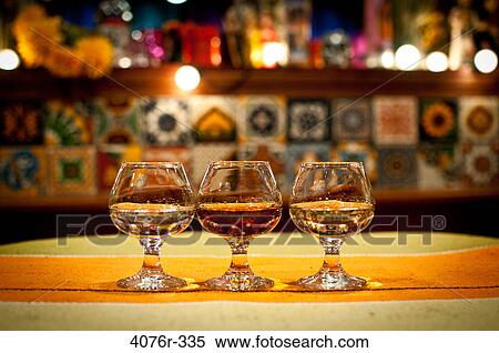 Close up of tequila shots on bar counter View Large Photo Image Stock Photography - Close up of tequila shots on bar counter. Fotosearch