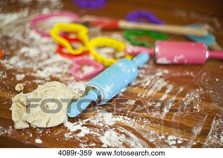 Close up of tray with flour, rolling pins and cookie cutters View Large Photo Image Stock Photo - Close up of tray with flour, rolling pins and cookie cutters. Fotosearch