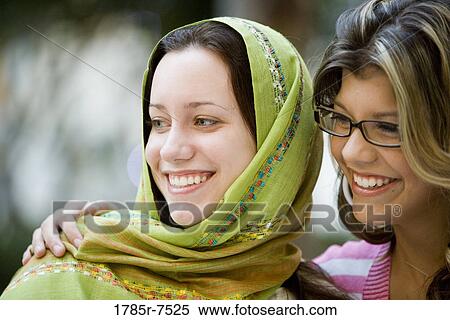 Close-up of two women friends smiling View Large Photo Image Stock Photography - Close-up of two women friends smiling. Fotosearch