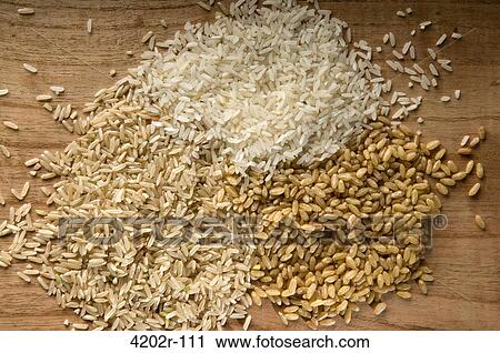 Close-up of uncooked rice View Large Photo Image Stock Image - Close-up of uncooked rice. Fotosearch