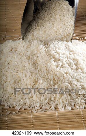 Stock Photo - Close-up of uncooked white rice. Fotosearch