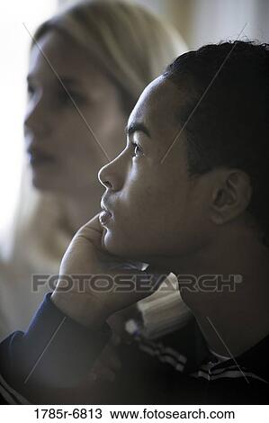 Close-up profile of a teenage boy in contemplation, mother in background View Large Photo Image Stock Image - Close-up profile of a teenage boy in contemplation, mother in background. Fotosearch
