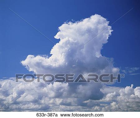 Clouds in a blue sky View Large Photo Image Stock Image - Clouds in a blue sky. Fotosearch