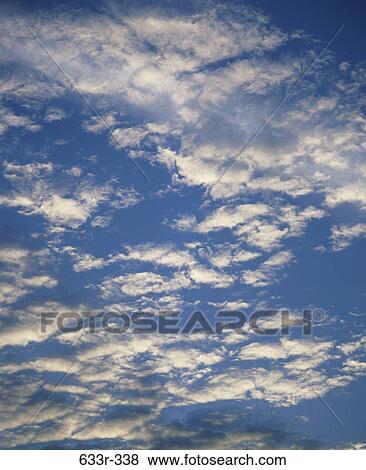 Clouds in a blue sky View Large Photo Image Stock Photo - Clouds in a blue sky. Fotosearch