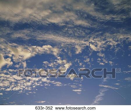 Clouds in the blue sky View Large Photo Image Stock Image - Clouds in the blue sky. Fotosearch