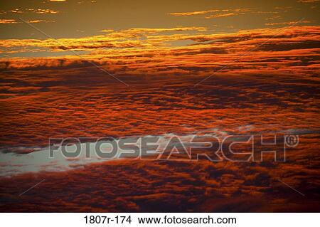 Clouds in the sky at sunset View Large Photo Image Picture - Clouds in the sky at sunset. Fotosearch