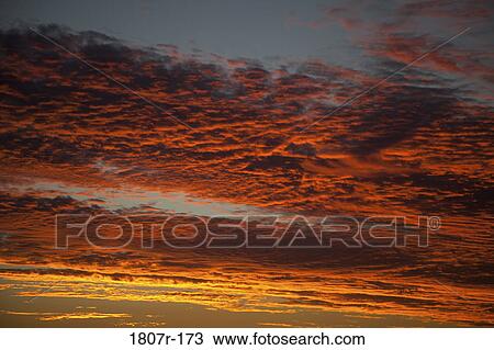 Clouds in the sky at sunset View Large Photo Image Stock Image - Clouds in the sky at sunset. Fotosearch