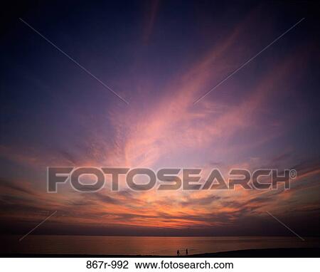 Clouds in the sky at sunset View Large Photo Image Stock Image - Clouds in the sky at sunset. Fotosearch