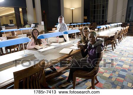 College students studying in library View Large Photo Image Stock Image - College students studying in library. Fotosearch