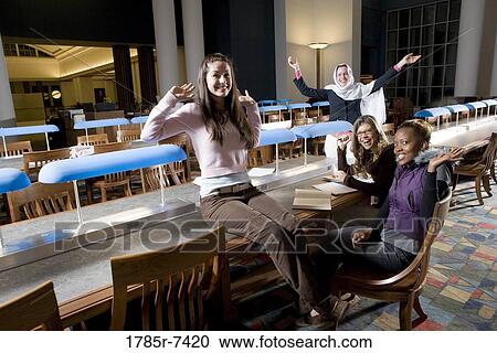 College students studying in library View Large Photo Image Stock Image - College students studying in library. Fotosearch