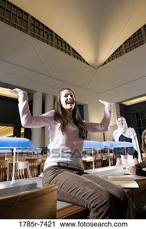 College students studying in library View Large Photo Image Stock Image - College students studying in library. Fotosearch