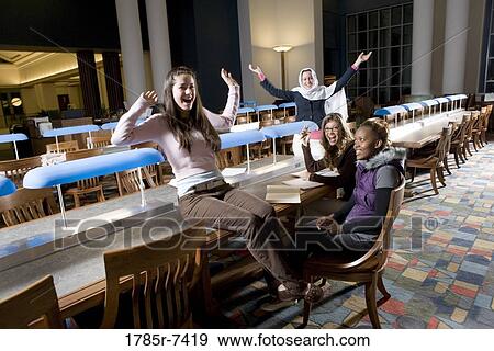 College students studying in library View Large Photo Image Stock Photo - College students studying in library. Fotosearch