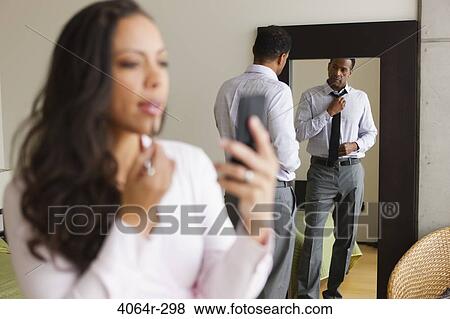 Couple getting ready in morning View Large Photo Image Stock Photo - Couple getting ready in morning. Fotosearch