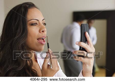 Stock Photography - Couple getting ready in morning. Fotosearch