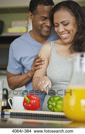 Couple making breakfast in loft apartment View Large Photo Image Picture - Couple making breakfast in loft apartment. Fotosearch