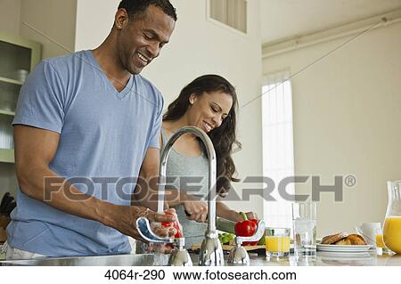 Couple making breakfast in loft apartment View Large Photo Image Stock Image - Couple making breakfast in loft apartment. Fotosearch