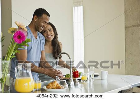 Couple making breakfast in loft apartment View Large Photo Image Stock Image - Couple making breakfast in loft apartment. Fotosearch