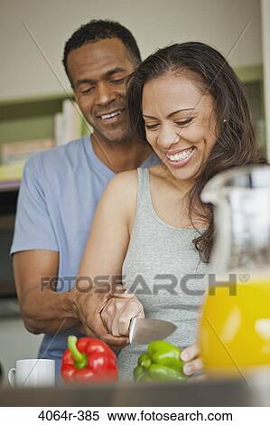 Couple making breakfast in loft apartment View Large Photo Image Stock Photography - Couple making breakfast in loft apartment. Fotosearch