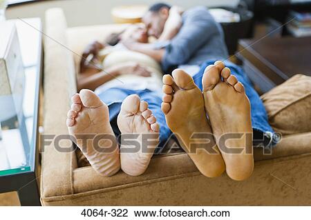 Couple relaxing in loft apartment View Large Photo Image Stock Image - Couple relaxing in loft apartment. Fotosearch