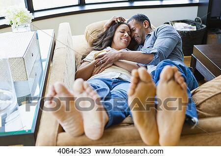 Couple relaxing in loft apartment View Large Photo Image Stock Image - Couple relaxing in loft apartment. Fotosearch