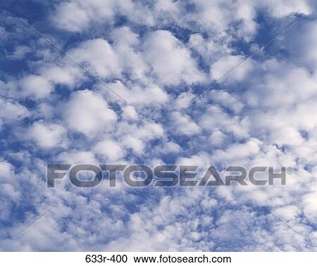 Cumulus clouds in a blue sky View Large Photo Image Stock Image - Cumulus clouds in a blue sky. Fotosearch