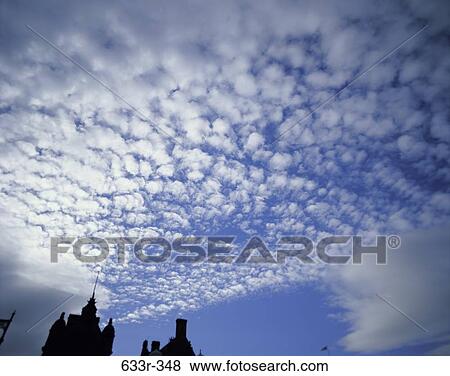 Cumulus clouds in a blue sky View Large Photo Image Stock Photo - Cumulus clouds in a blue sky. Fotosearch