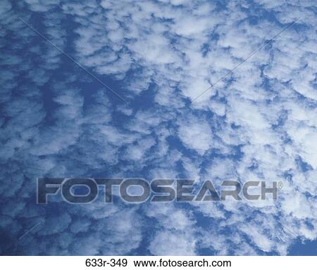 Cumulus clouds in a blue sky View Large Photo Image Stock Photo - Cumulus clouds in a blue sky. Fotosearch