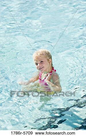 Stock Photo - Cute little girl in swimming pool. Fotosearch