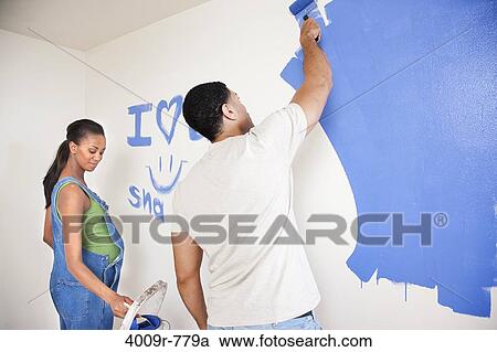 Expectant couple painting nursery View Large Photo Image Stock Image - Expectant couple painting nursery. Fotosearch