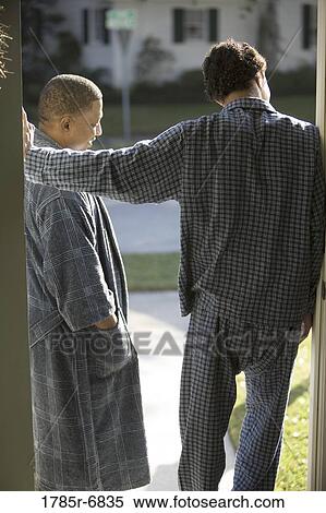 Father and son in pajamas standing at doorway View Large Photo Image Stock Photography - Father and son in pajamas standing at doorway. Fotosearch