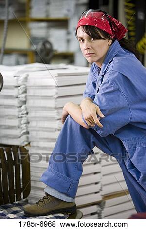 Female worker in a storage warehouse View Large Photo Image Stock Photo - Female worker in a storage warehouse. Fotosearch