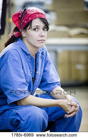 Female worker in a storage warehouse View Large Photo Image Stock Photo - Female worker in a storage warehouse. Fotosearch