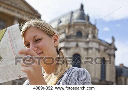 France, Ile-De-France, Paris, Versailles, Teenage girl reading map at Chateau De Versailles View Large Photo Image Stock Image - France, Ile-De-France, Paris, Versailles, Teenage girl reading map at Chateau De Versailles. Fotosearch