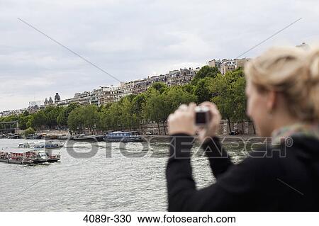 France, Ile-De-France, Paris, Teenage girl photographing Seine River View Large Photo Image Stock Image - France, Ile-De-France, Paris, Teenage girl photographing Seine River. Fotosearch