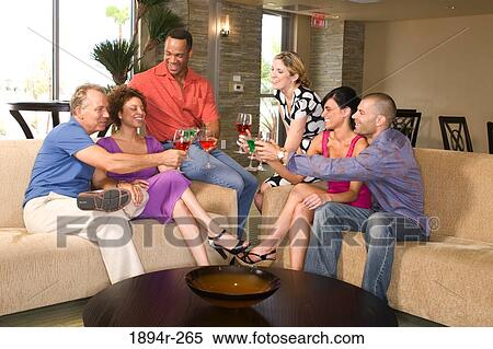 Stock Photography - Friends having drinks in the bar of a tourist resort. Fotosearch