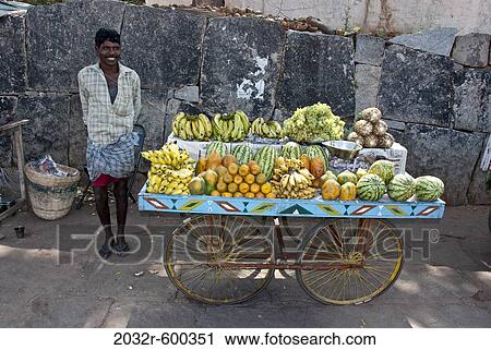 Fruit seller on a street with fruit cart, Hampi, Karnataka, India View Large Photo Image Stock Image - Fruit seller on a street with fruit cart, Hampi, Karnataka, India. Fotosearch