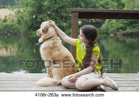 Girl with Golden Retriever on jetty View Large Photo Image Stock Image - Girl with Golden Retriever on jetty. Fotosearch
