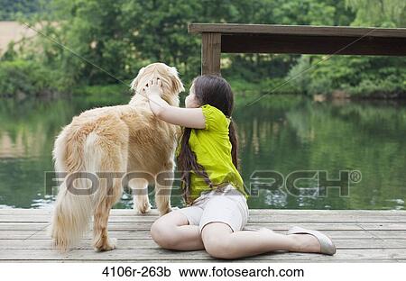 Girl with Golden Retriever on jetty View Large Photo Image Stock Image - Girl with Golden Retriever on jetty. Fotosearch