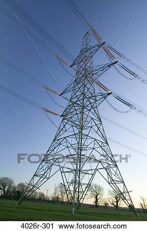 Stock Image - Great Britain, British Isles, electricity pylon of National Grid at sunset. Fotosearch